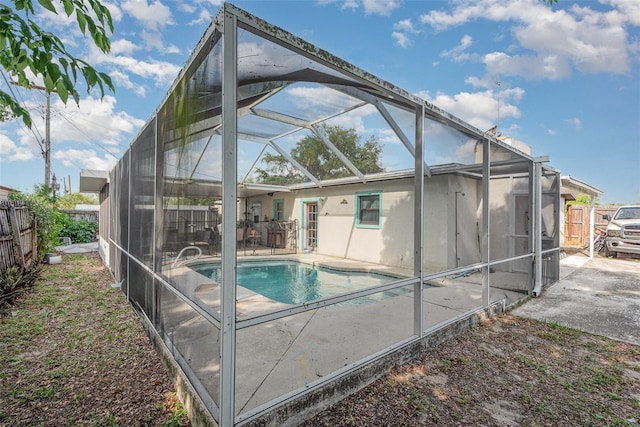 4520 Browning Ave, Titusville, FL 32780 - view of swimming pool featuring a patio area, a fenced in pool, fence, and glass enclosure