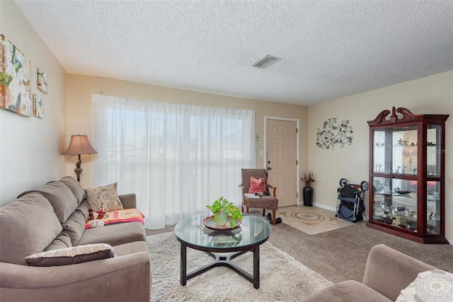 4520 Browning Ave, Titusville, FL 32780 - living area featuring visible vents, carpet floors, and a textured ceiling