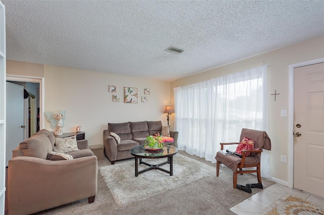 4520 Browning Ave, Titusville, FL 32780 - carpeted living area with a textured ceiling and visible vents
