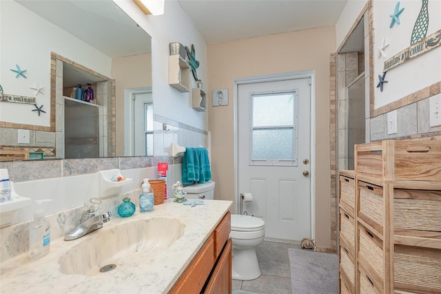 4520 Browning Ave, Titusville, FL 32780 - full bath featuring a shower stall, tile patterned floors, vanity, and toilet