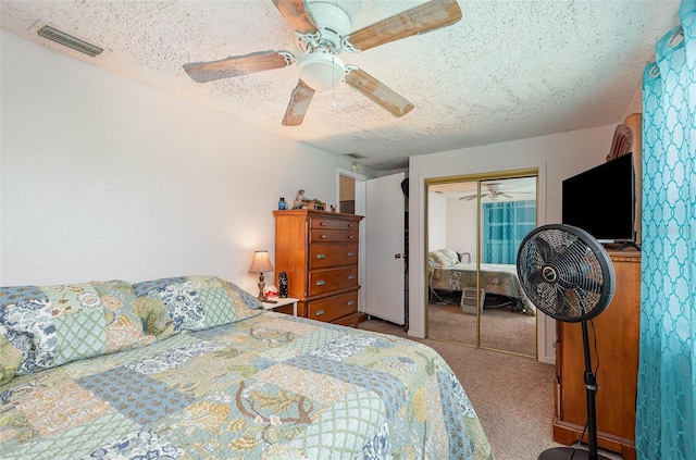 4520 Browning Ave, Titusville, FL 32780 - bedroom featuring a closet, a textured ceiling, carpet floors, visible vents, and ceiling fan