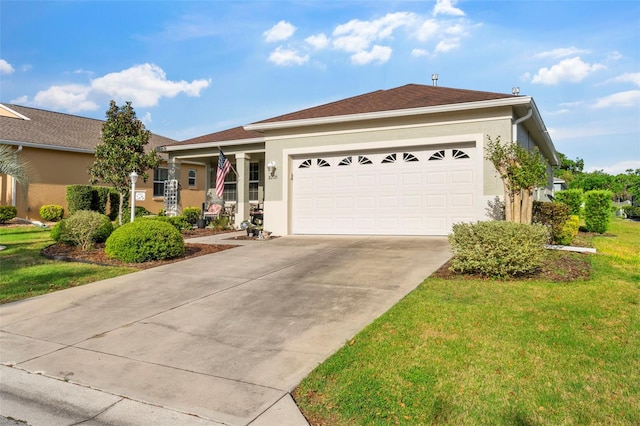ranch-style home featuring a front yard, stucco siding, a garage, and concrete driveway