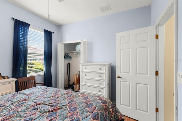 bedroom featuring a closet and visible vents