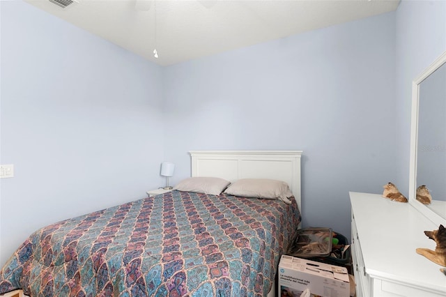 bedroom with ceiling fan and visible vents