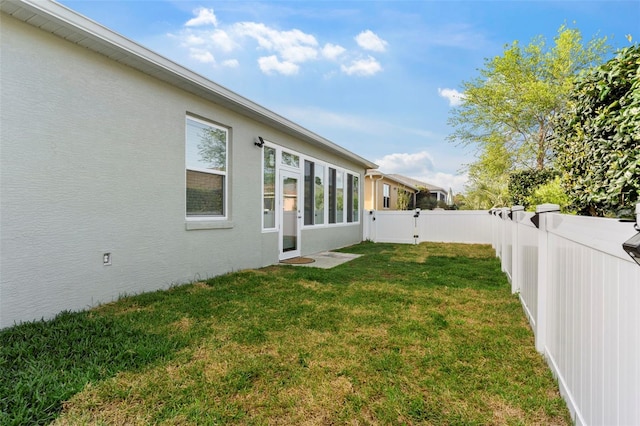 view of yard featuring a fenced backyard