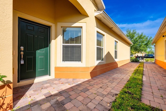 3205 Sonesta Ct Unit F, Clermont, FL 34711 - view of exterior entry featuring stucco siding