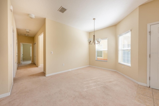 3205 Sonesta Ct Unit F, Clermont, FL 34711 - empty room with light carpet, baseboards, a chandelier, and visible vents