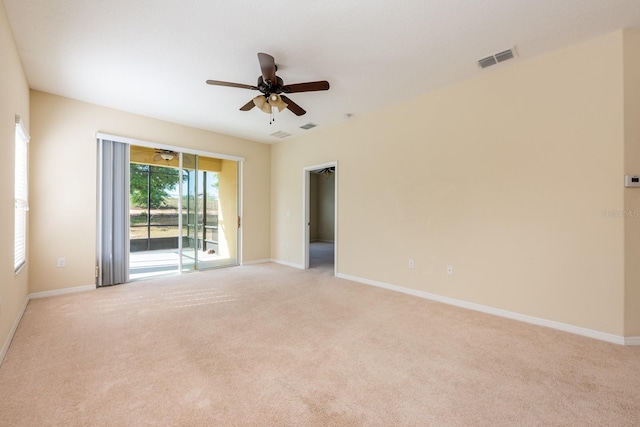 3205 Sonesta Ct Unit F, Clermont, FL 34711 - empty room featuring a ceiling fan, light carpet, baseboards, and visible vents