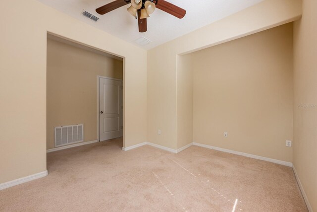 3205 Sonesta Ct Unit F, Clermont, FL 34711 - empty room with baseboards, visible vents, a ceiling fan, and light colored carpet