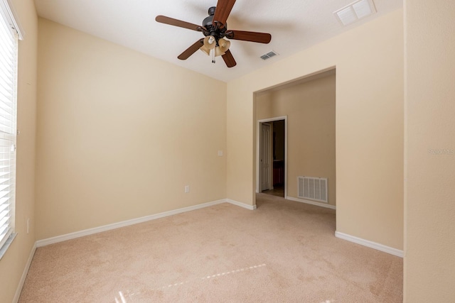 3205 Sonesta Ct Unit F, Clermont, FL 34711 - unfurnished room with visible vents, a ceiling fan, and light colored carpet
