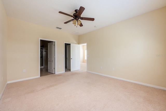 3205 Sonesta Ct Unit F, Clermont, FL 34711 - unfurnished bedroom with ensuite bathroom, baseboards, light colored carpet, and visible vents