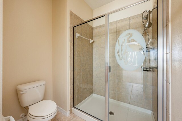 3205 Sonesta Ct Unit F, Clermont, FL 34711 - full bathroom featuring toilet, tile patterned floors, baseboards, and a shower stall