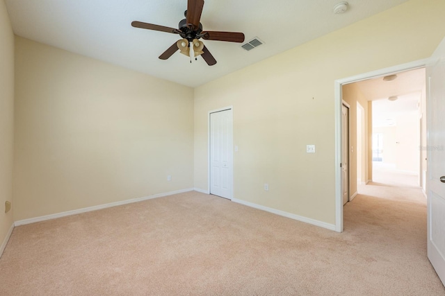 3205 Sonesta Ct Unit F, Clermont, FL 34711 - spare room with light colored carpet, visible vents, baseboards, and a ceiling fan