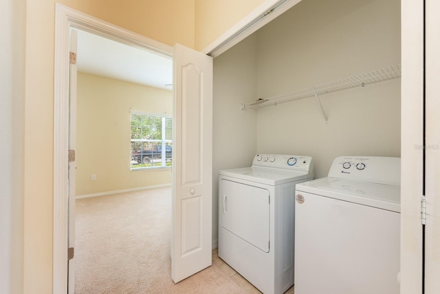 3205 Sonesta Ct Unit F, Clermont, FL 34711 - washroom with laundry area, washing machine and dryer, baseboards, and light colored carpet