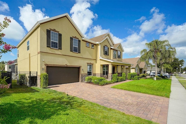 1802 Candlenut Cir, Apopka, FL 32712 - view of front of property featuring stucco siding, stone siding, fence, and an attached garage