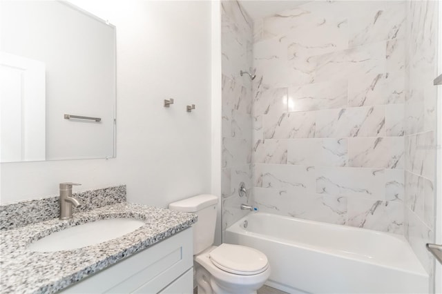 bathroom featuring vanity, toilet, and shower / washtub combination