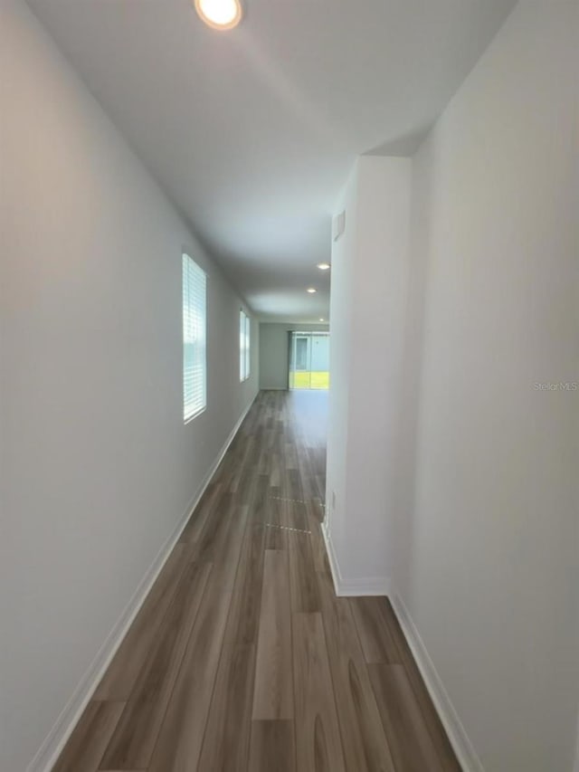 6028 Bimini Ave, Haines City, FL 33844 - corridor featuring dark wood-style flooring, baseboards, and recessed lighting