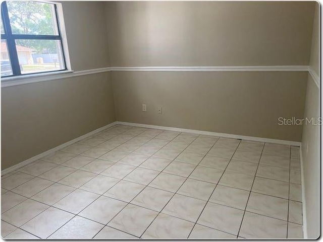 4736 Southold St, Orlando, FL 32808 - spare room featuring baseboards