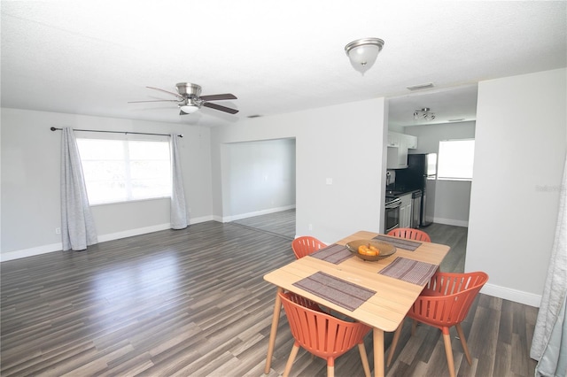 1831 Aaron Ave, Orlando, FL 32811 - dining area featuring a ceiling fan, dark wood finished floors, baseboards, and visible vents