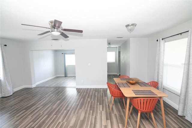 1831 Aaron Ave, Orlando, FL 32811 - dining space featuring baseboards, a textured ceiling, ceiling fan, and wood finished floors