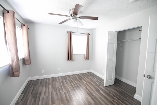 1831 Aaron Ave, Orlando, FL 32811 - unfurnished bedroom with a closet, a textured ceiling, baseboards, ceiling fan, and wood finished floors
