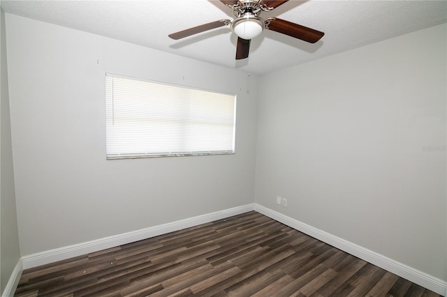 1831 Aaron Ave, Orlando, FL 32811 - spare room with baseboards, ceiling fan, dark wood-type flooring, and a textured ceiling