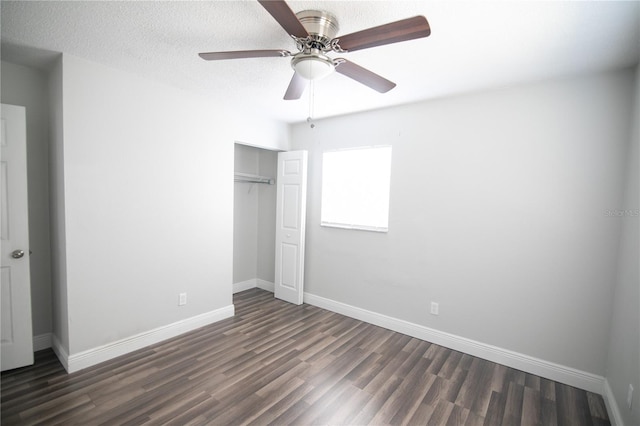1831 Aaron Ave, Orlando, FL 32811 - unfurnished bedroom with baseboards, a textured ceiling, dark wood finished floors, a ceiling fan, and a closet