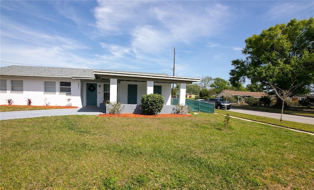 1831 Aaron Ave, Orlando, FL 32811 - view of front of home featuring stucco siding, driveway, and a front lawn