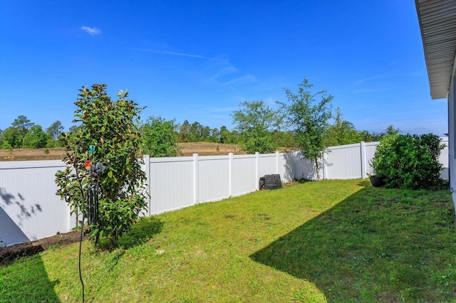 view of yard with a fenced backyard