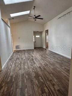 unfurnished living room featuring a skylight, visible vents, wood finished floors, and ceiling fan