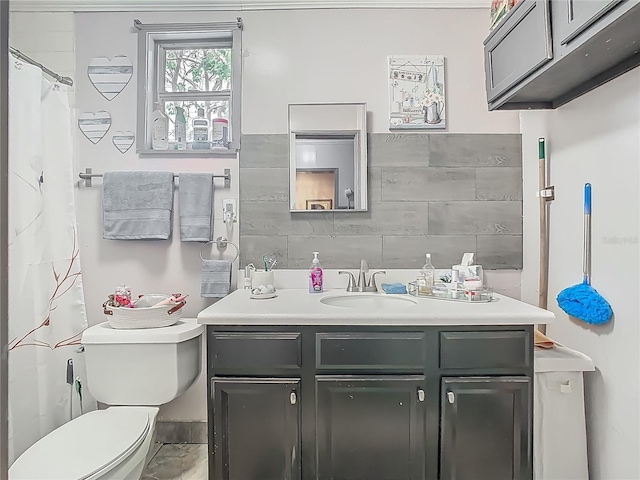 bathroom featuring toilet and vanity