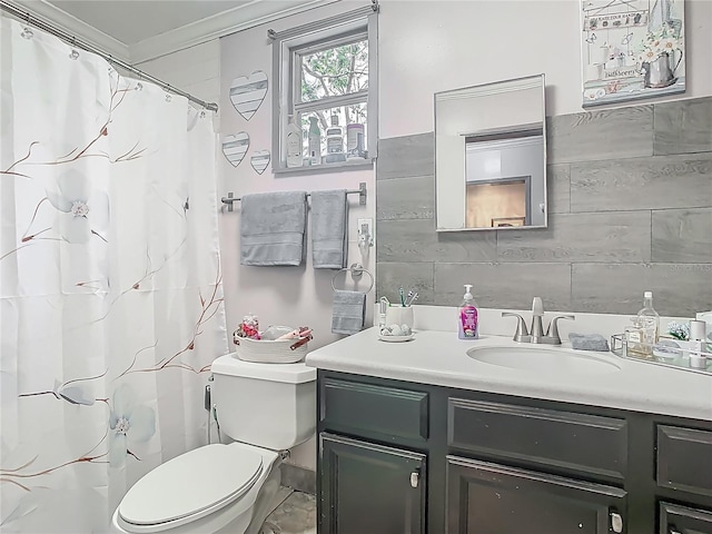 full bathroom with tile walls, ornamental molding, toilet, vanity, and a shower with curtain