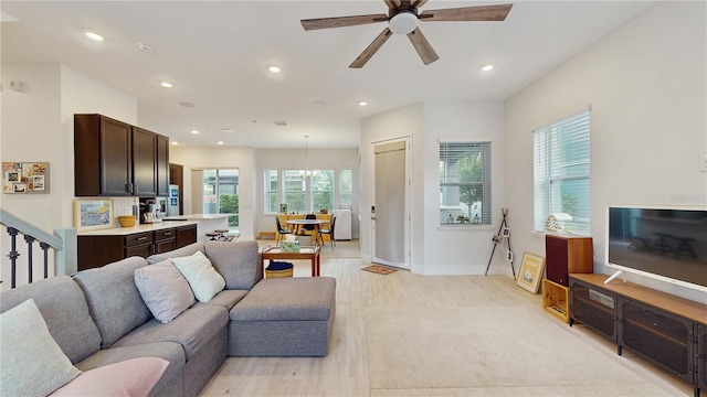 13241 Cormack Ln, Orlando, FL 32827 - living room with baseboards, ceiling fan, recessed lighting, and light wood-type flooring
