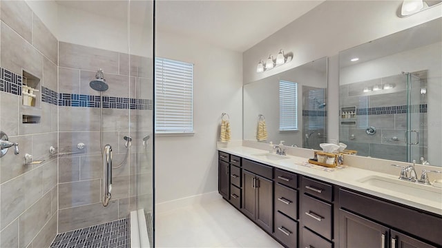 13241 Cormack Ln, Orlando, FL 32827 - bathroom with double vanity, a sink, tile patterned flooring, and a shower stall