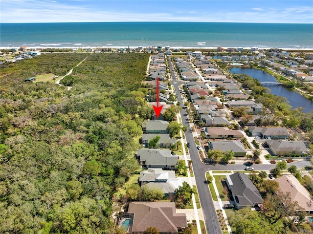bird's eye view featuring a water view and a residential view