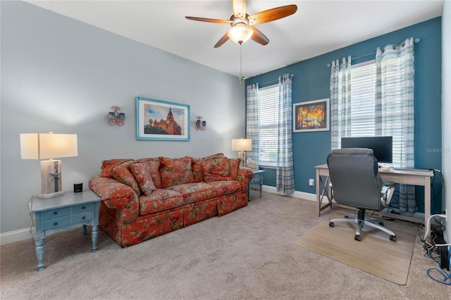 home office with carpet floors, baseboards, and ceiling fan