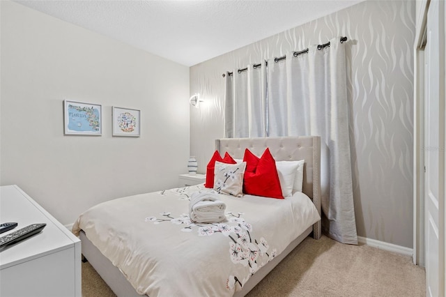 carpeted bedroom with a textured ceiling