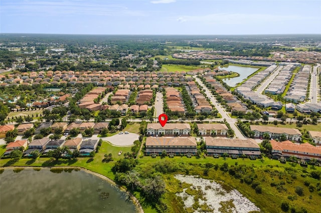 aerial view with a residential view and a water view
