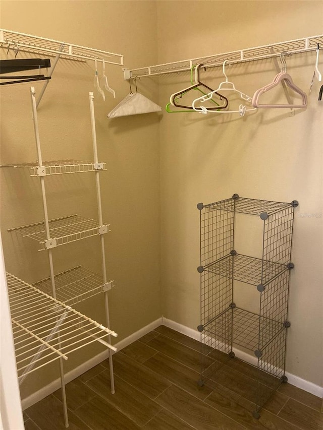 spacious closet with wood finish floors