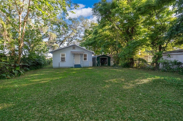 1204 34th St, Orlando, FL 32805 - view of yard with an outbuilding, fence, and a shed