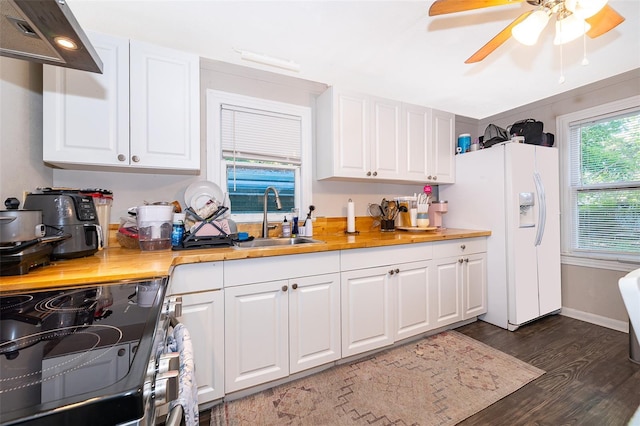 1204 34th St, Orlando, FL 32805 - kitchen with stainless steel electric range, white refrigerator with ice dispenser, under cabinet range hood, dark wood finished floors, and a sink