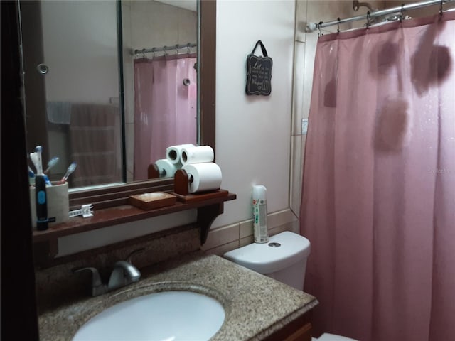 1204 34th St, Orlando, FL 32805 - bathroom with toilet, vanity, and a shower with curtain