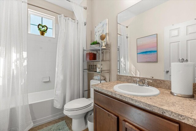 full bathroom with shower / tub combo, toilet, vanity, and tile patterned flooring