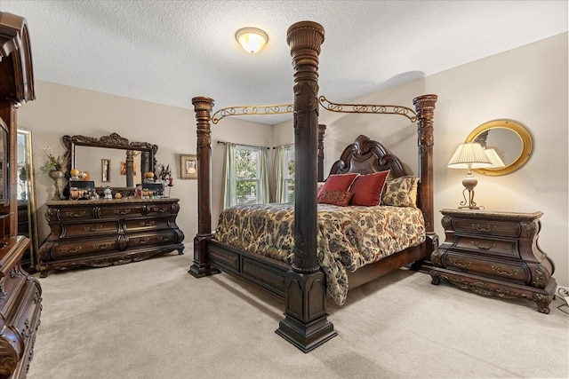 carpeted bedroom featuring a textured ceiling