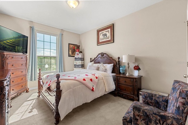 bedroom with light colored carpet