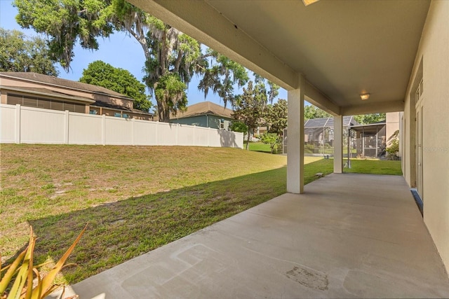view of yard with fence and a patio