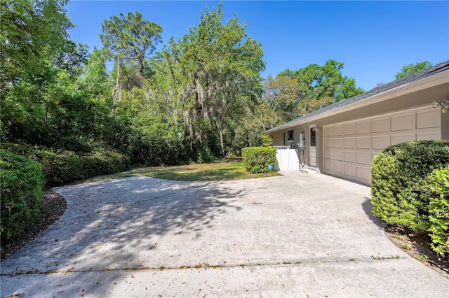 8 Trilby Br, Longwood, FL 32779 - view of yard featuring a garage and concrete driveway