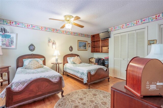 8 Trilby Br, Longwood, FL 32779 - bedroom featuring a textured ceiling, wood finished floors, a closet, and a ceiling fan