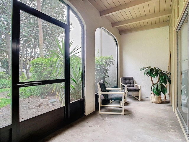 sunroom with beam ceiling