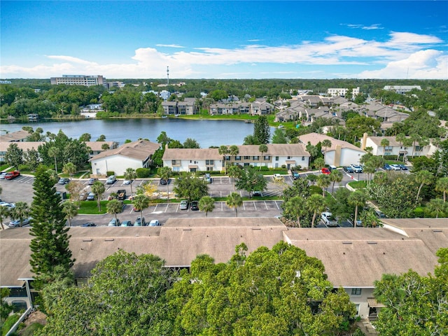 aerial view of residential area featuring a large body of water